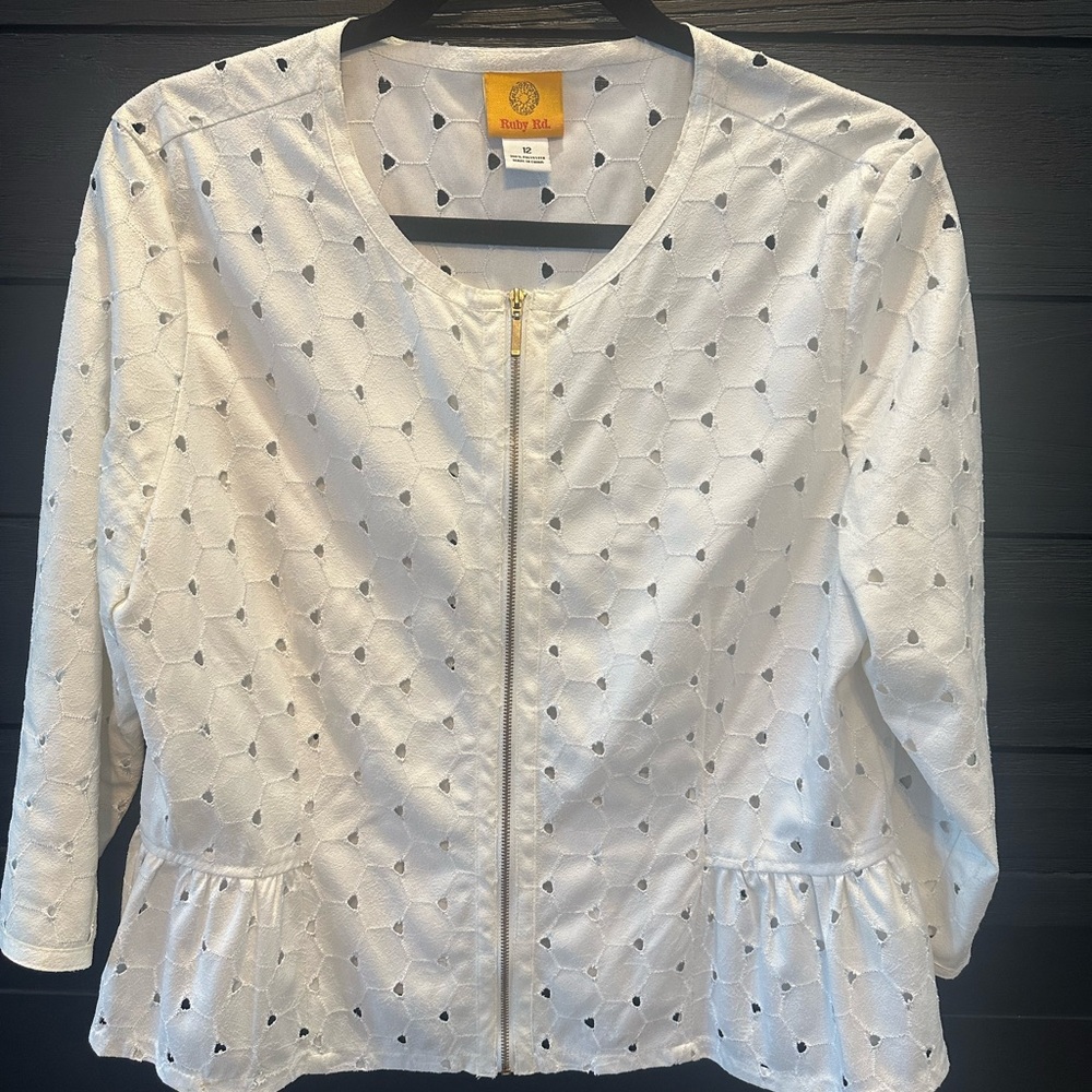 Oh so pretty and girly! Eyelet peplum jacket/top. Metal gold zipper front.